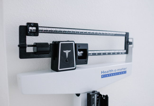 weighing scale usually found in a doctor's office
